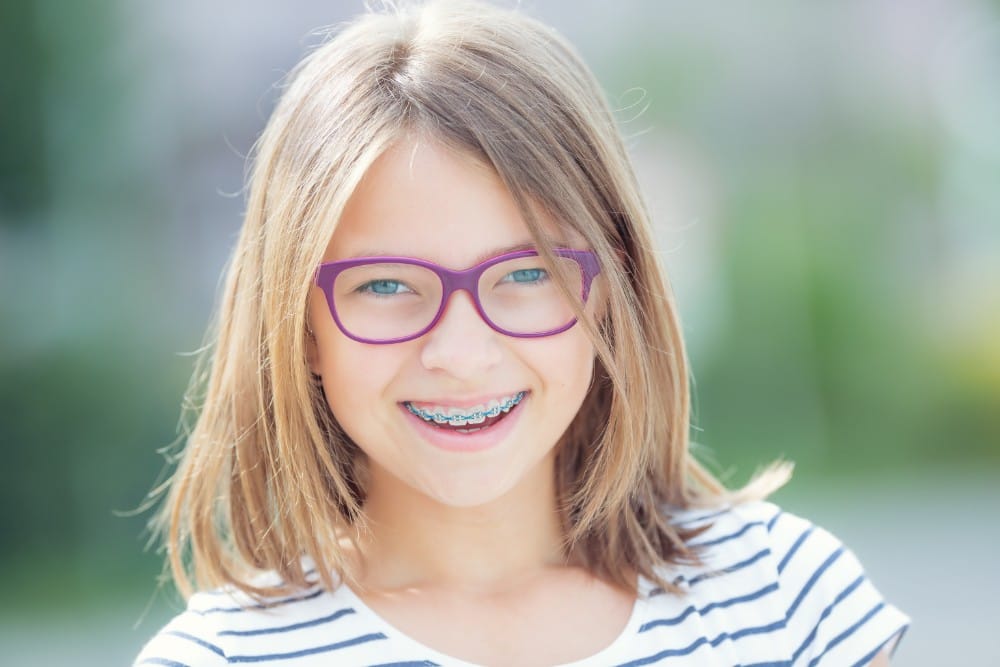 Girl with glasses and braces